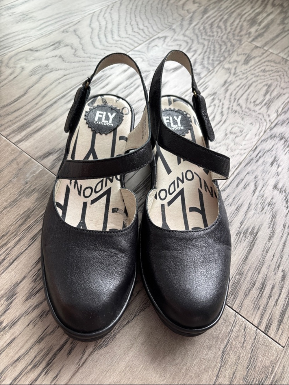 Fly London Black Leather Cross-Strap Slingback Mules